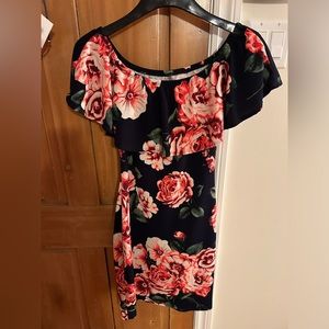 Beautiful summer dress with thrill detail. Hits at the knee, stretchy.